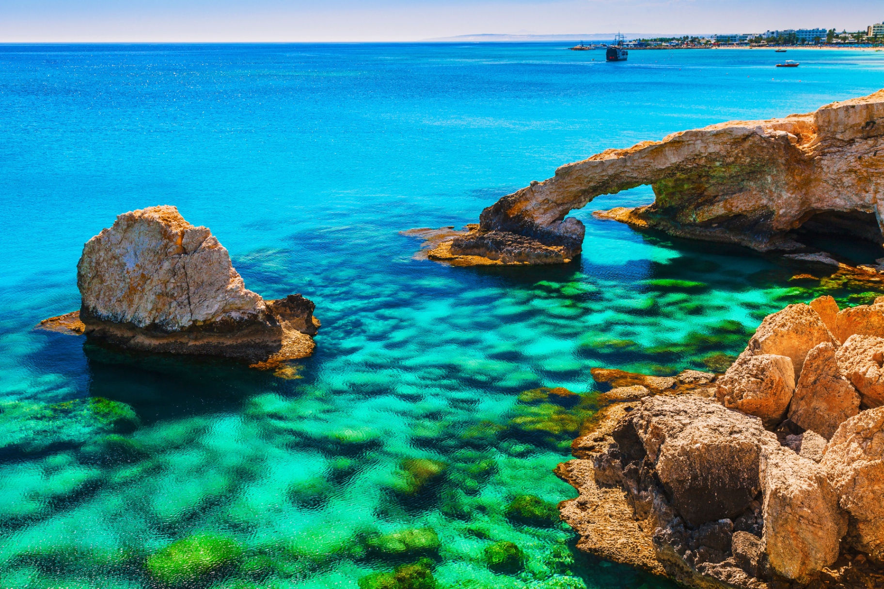 Rock arch and turquoise sea, long-term, deep-rooted partnerships